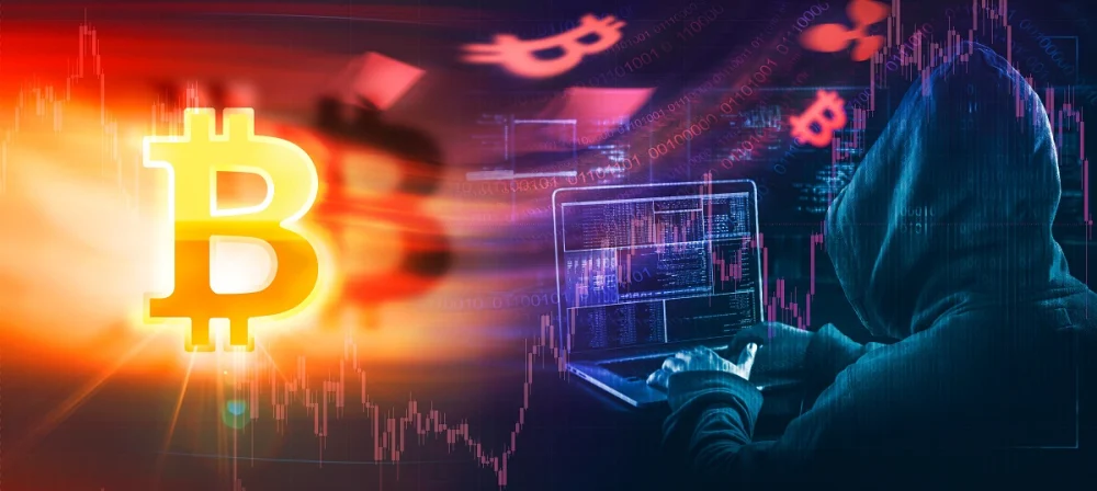 A hooded hacker figure typing on a laptop beside a glowing Bitcoin symbol, representing cryptocurrency crime and the need for KYC verification in crypto exchanges
