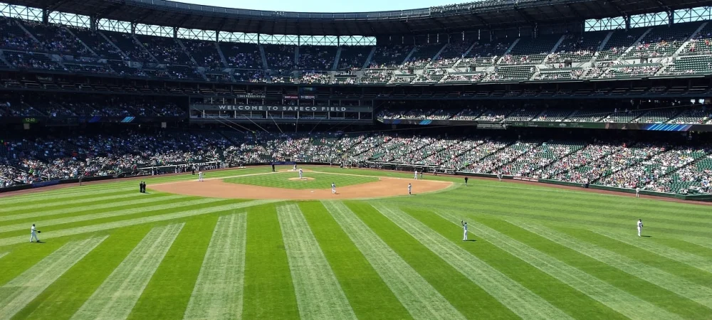 A packed baseball stadium with players on the field, illustrating how large crowds require OSINT-enabled security to monitor online threats before and during events