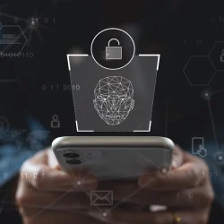 Person holding a smartphone with a digital lock and facial recognition overlay, representing identity verification and biometric authentication in identity intelligence.