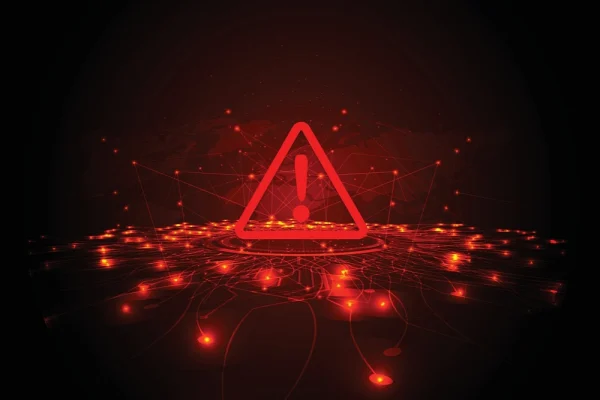 Red digital warning symbol over a glowing network map, representing cybersecurity threats and the importance of threat intelligence tools in identifying and mitigating risks