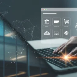 Person typing on a laptop with a digital cybersecurity interface overlay showing icons for banking and credit card authentication, representing KYC integration in financial systems