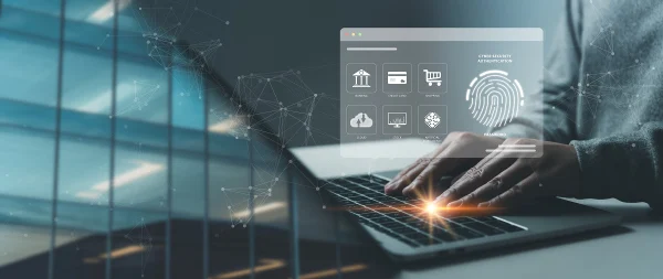 Person typing on a laptop with a digital cybersecurity interface overlay showing icons for banking and credit card authentication, representing KYC integration in financial systems