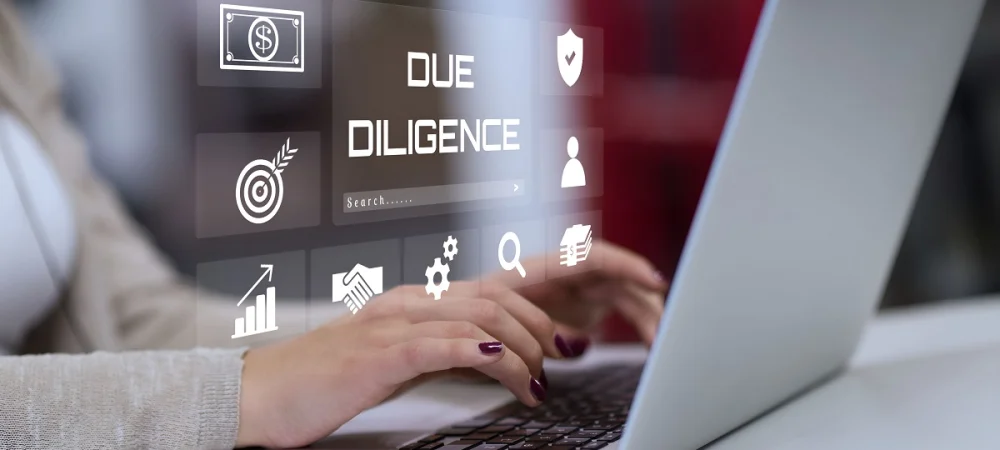 Person using a laptop with digital icons symbolizing customer risk assessment and compliance processes in KYC and CDD