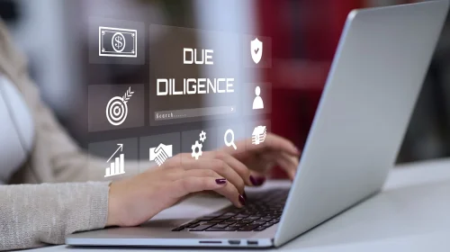 Person using a laptop with digital icons symbolizing customer risk assessment and compliance processes in KYC and CDD