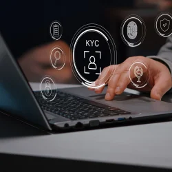 Person using a laptop surrounded by virtual KYC icons, representing online identity verification and secure onboarding in banking