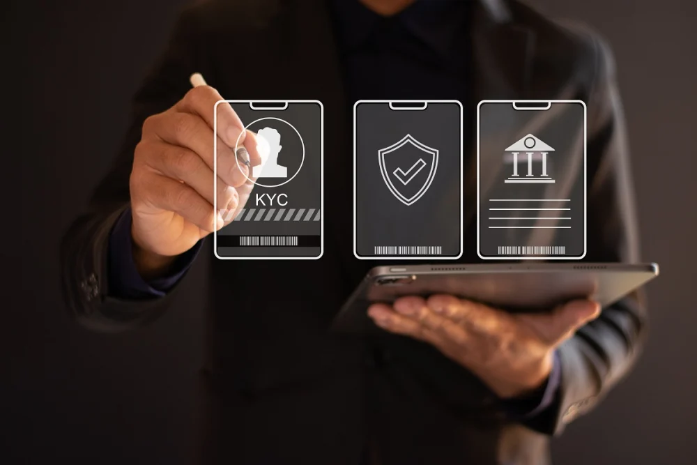 Business professional interacting with virtual KYC interface on a tablet, representing digital identity verification and customer due diligence in banking compliance
