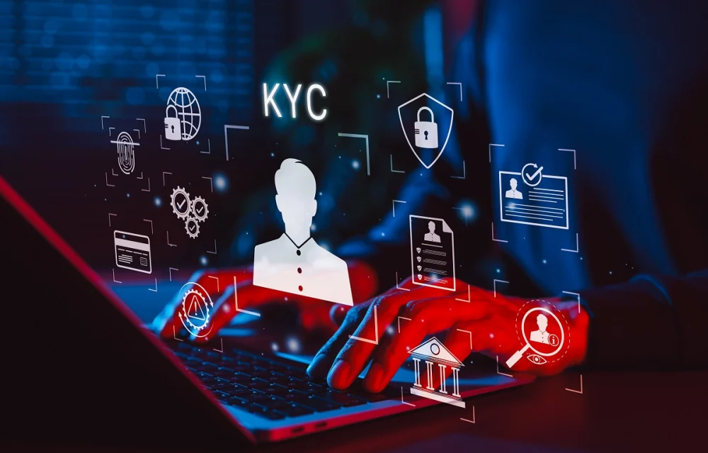 Person using a laptop with glowing “KYC” icons and digital identity symbols, illustrating automated KYC verification processes